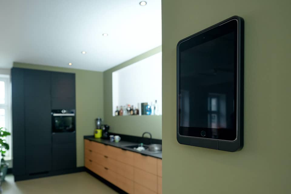 Viveroo one iPad mount as metal black integrated into kitchen.